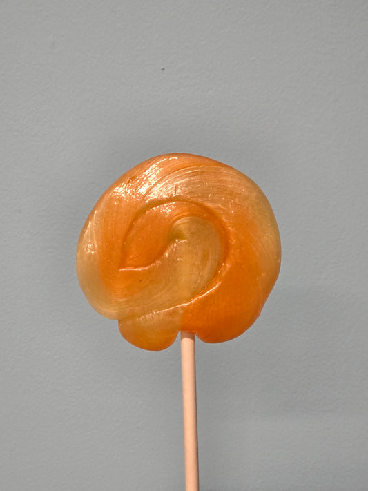 Vegan handmade tangerine swirl lollipops