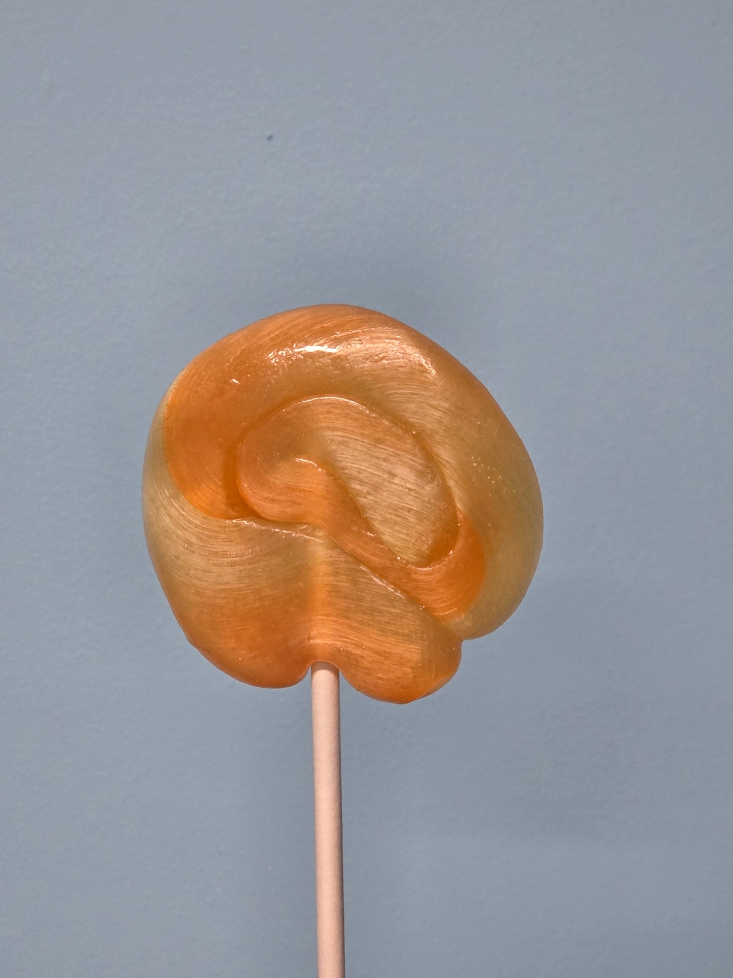 Vegan handmade tangerine swirl lollipops