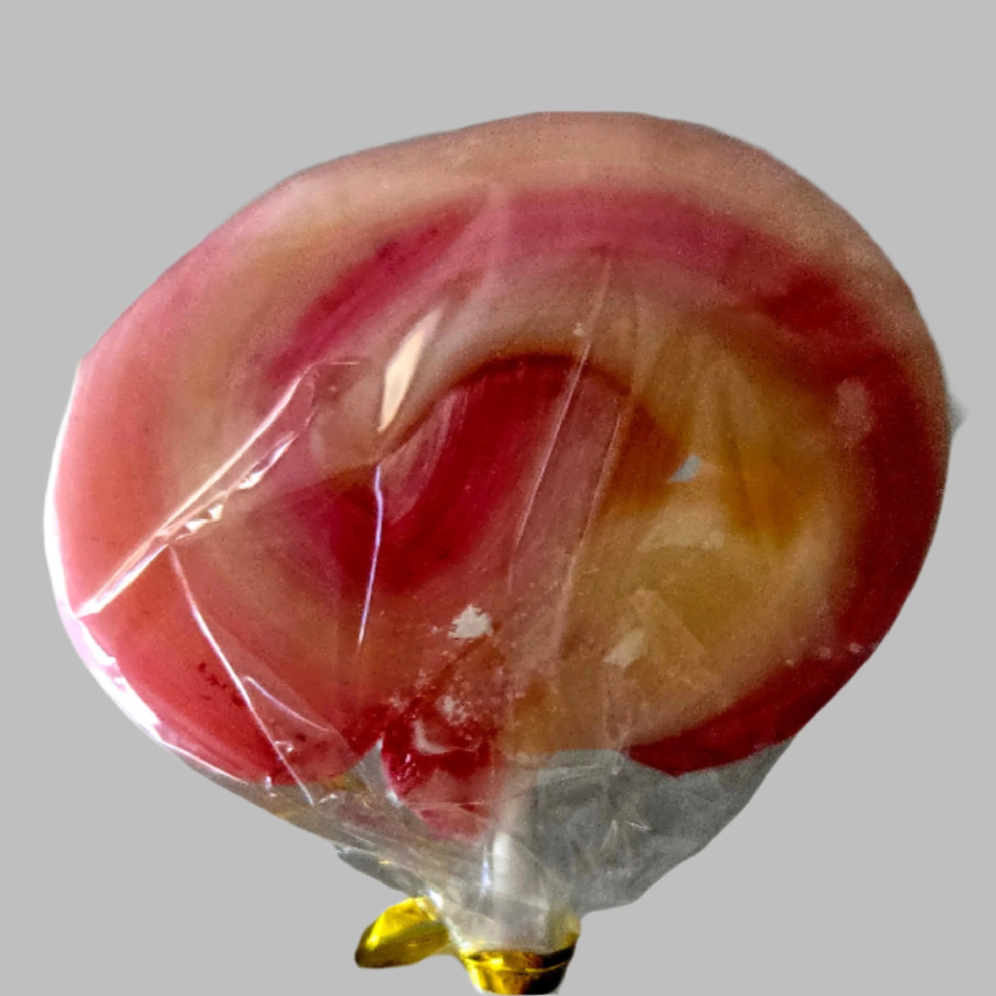 strawberry flavored hand pulled swirl lollipop